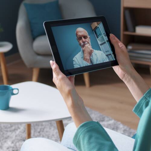 Woman having a video call with her doctor